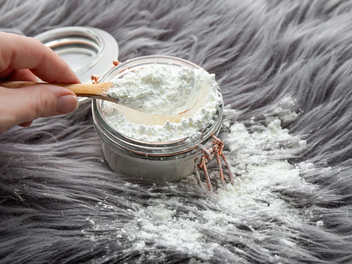 How to Remove Water Stains From Fabric 2 Adding baking soda on a blanket to clean it