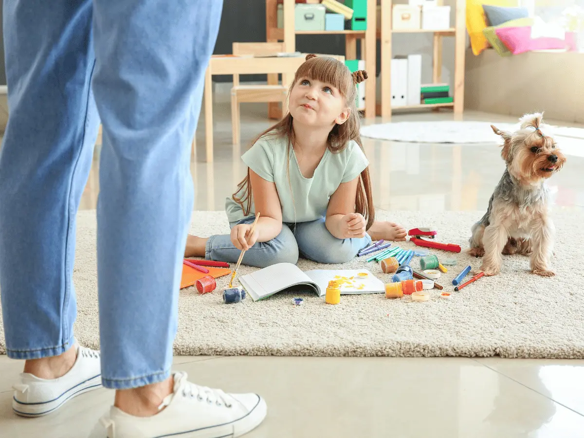 Girl Playing with paint on the carpet