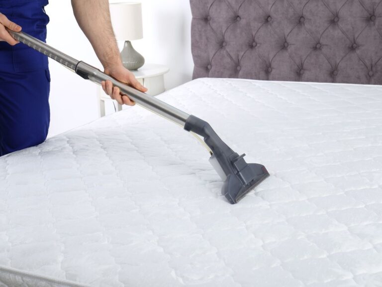 vacuuming mattress with an upholstery head